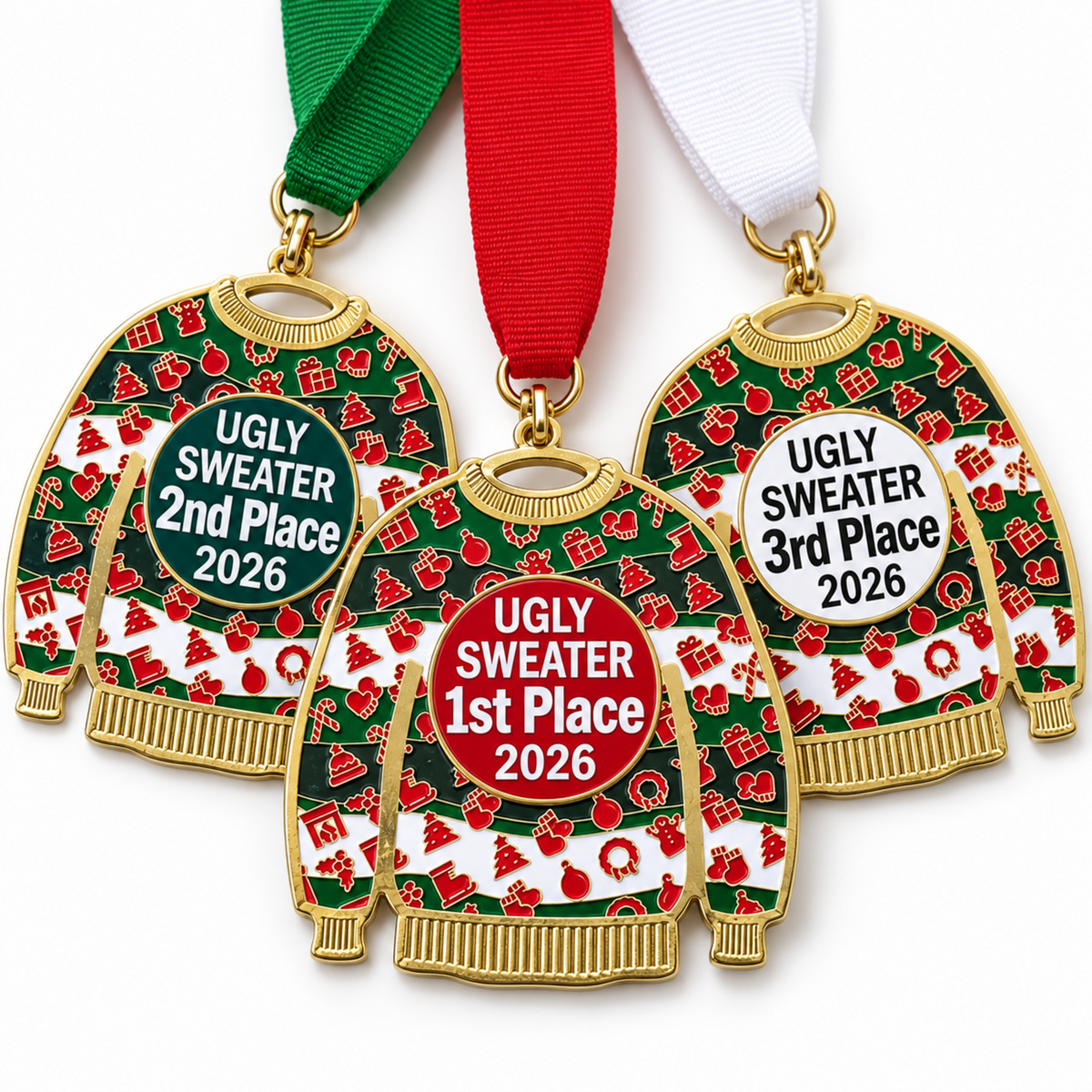 Three holiday-themed medal ornaments shaped like Christmas sweaters, each with a ribbon and a circular badge reading 'UGLY SWEATER 1st/2nd/3rd Place 2026.' The sweaters are green with red and white festive patterns, gold-tone outlines, and red, white, and green ribbons.